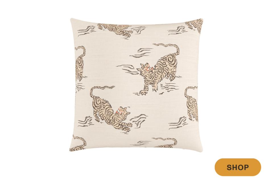 Coastal-style pillow with cream background and tan hand-drawn tiger illustrations