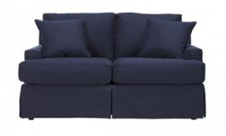 Deep navy upholstered sofa with classic coastal living room appeal