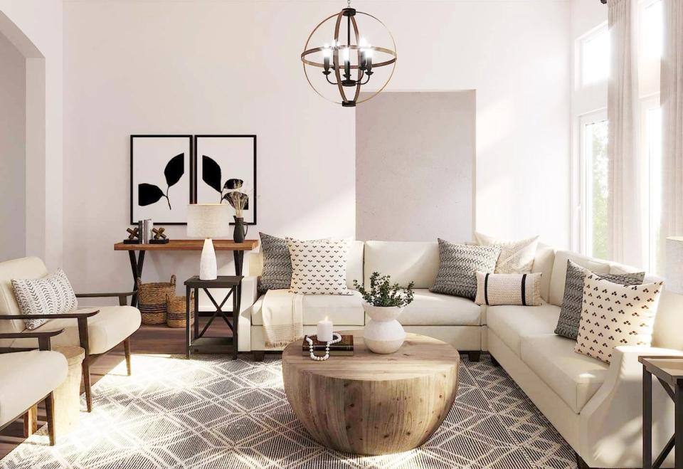 Bright, airy living room blending organic modern style with natural wood accents, neutral textiles, and botanical wall art