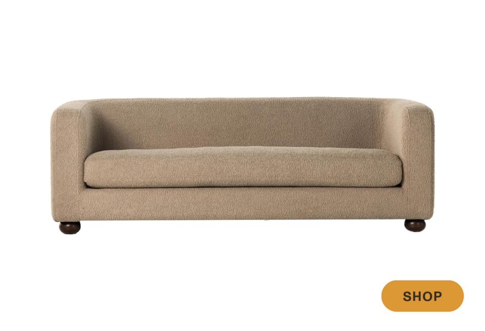 Compact modern camel sofa with curved arms and contemporary minimalist design