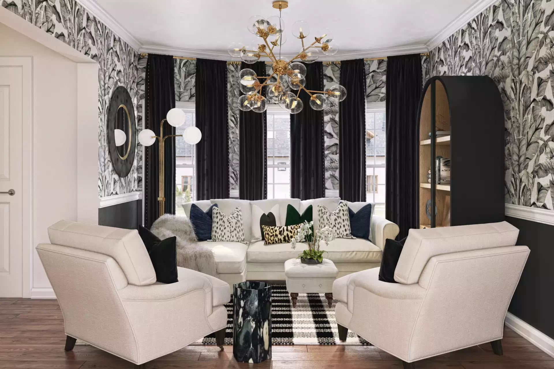Glamorous living room with black peel-and-stick toile wallpaper, cream furniture, and gold brass accents creating sophisticated contrast.