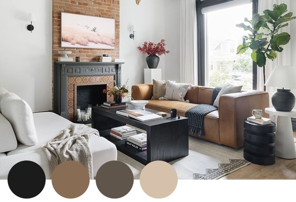 Industrial-modern living room pairing chocolate brown and warm taupe with exposed brick fireplace, cognac leather sofa, and black steel accents.