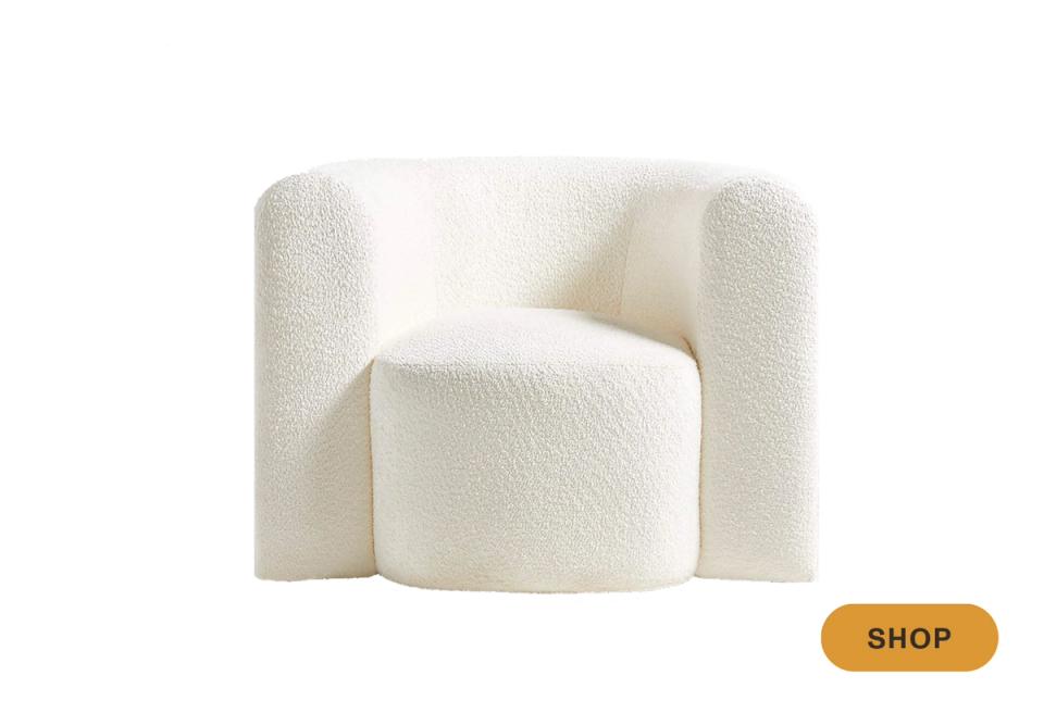 Contemporary sculptural swivel chair in cream boucle fabric
