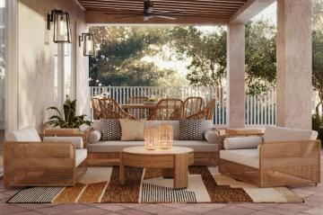 Warm coastal patio with woven furniture, wood pergola, and earthy neutral palette