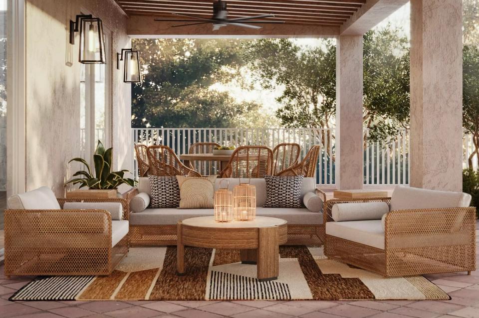 Warm coastal patio with woven furniture, wood pergola, and earthy neutral palette