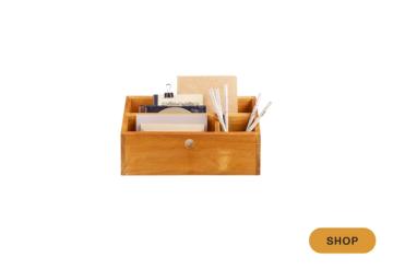 Natural wood desktop organizer with angled compartments for office supplies