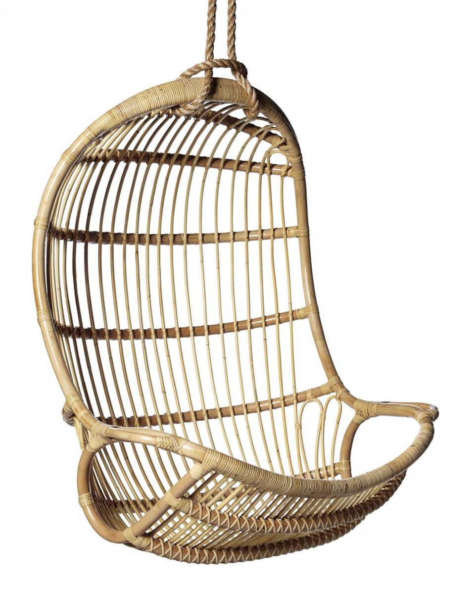 Natural woven rattan hanging egg chair with rope suspension and organic silhouette