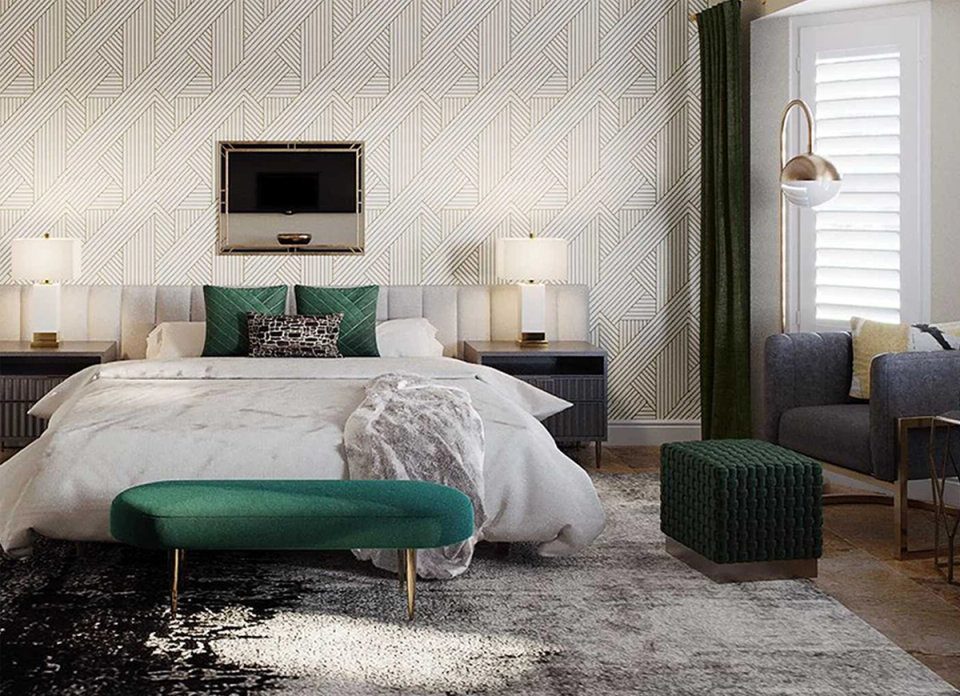 Modern bedroom with geometric wallpaper, emerald green accents, and minimalist neutral palette