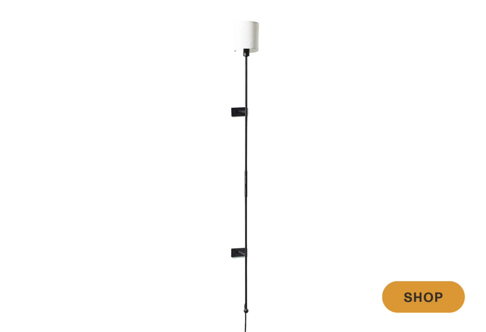 Modern minimalist black and white linear sconce with stacked geometric form