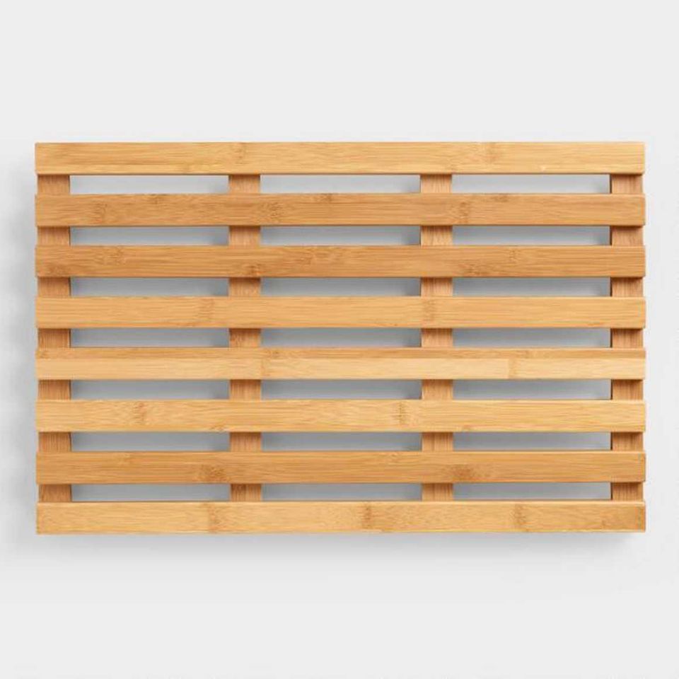 Natural wood slatted panel with spa aesthetic, creating warm minimalist bathroom ambiance