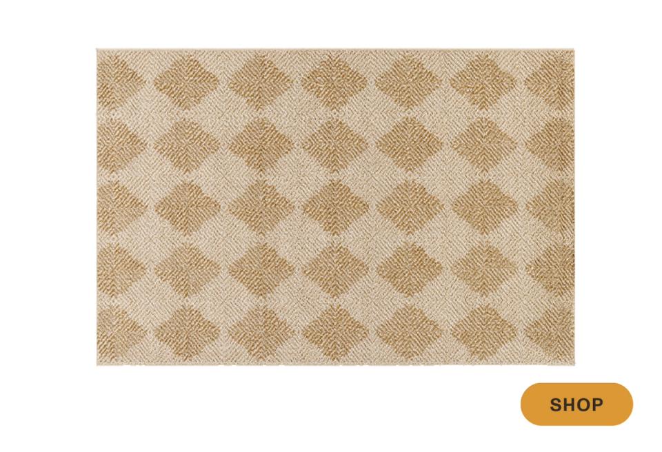 Transitional diamond patterned rug in warm beige and cream tones
