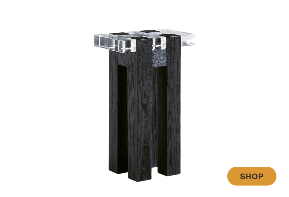 Contemporary martini table featuring stacked black wood base with chrome top accent
