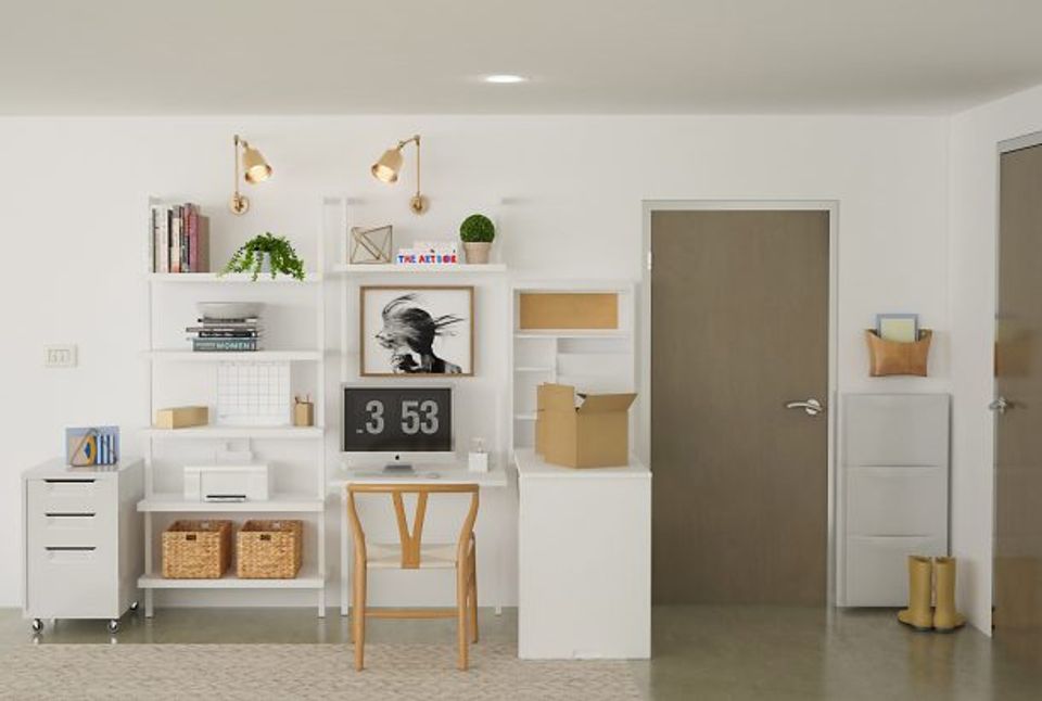Minimalist workspace featuring white modular shelving, woven storage baskets, and neutral earth-tone palette