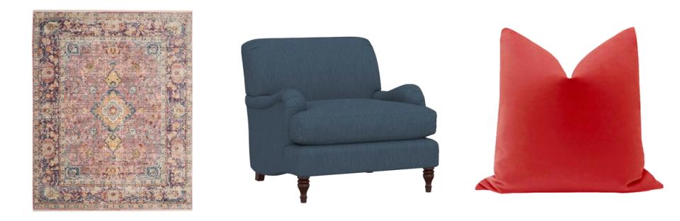 Design elements: vintage rug, navy upholstered chair, and bold red pillow