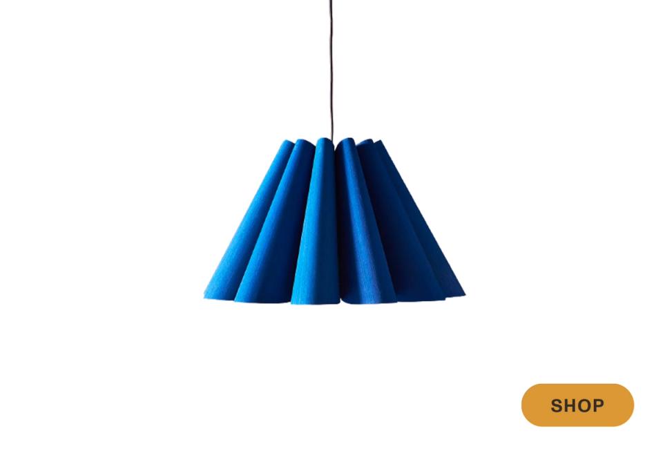 Bold cobalt blue pleated pendant with dramatic sculptural silhouette