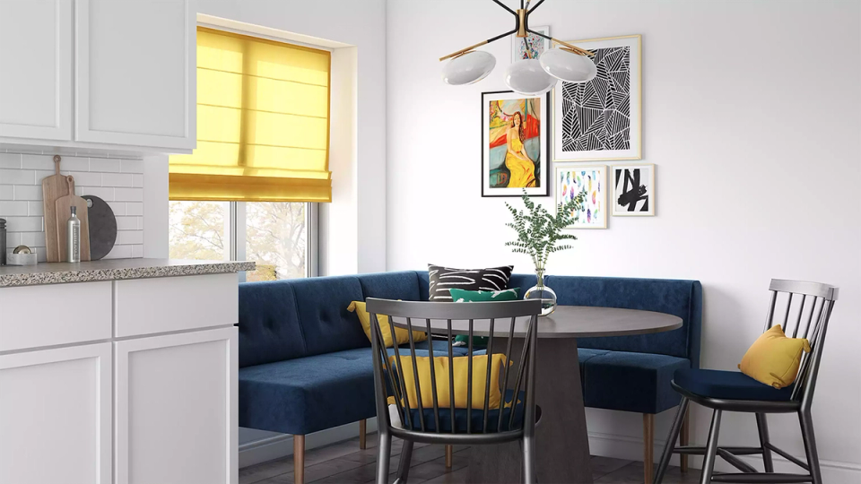 Transitional dining nook blending natural light, navy accents, warm wood, and clean modern lines