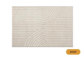Contemporary minimalist rug with organic curved line pattern in cream and white