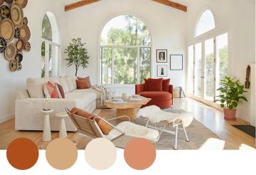 Warm, earthy living room with rust and terracotta tones, natural wood beams, and abundant natural light for a welcoming, organic feel