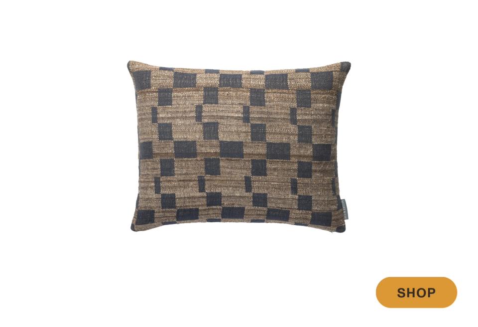 Traditional woven pillow with navy and tan checkerboard pattern for classic appeal