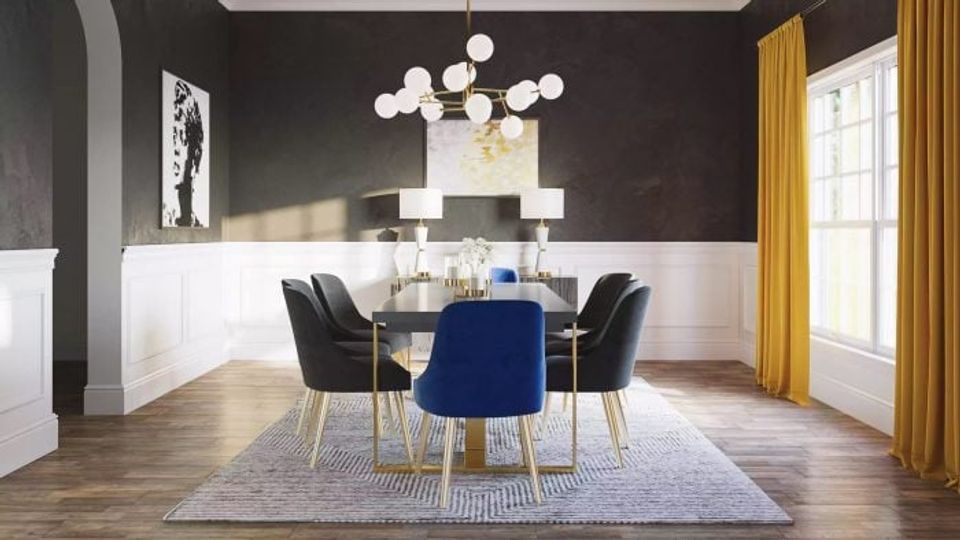 Modern dining room with charcoal black upper walls, white shiplap wainscoting, cobalt blue chair, and gold accents creating sophisticated contrast.