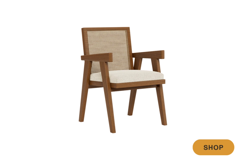 Mid-century modern wood chair with natural caning and cream cushion