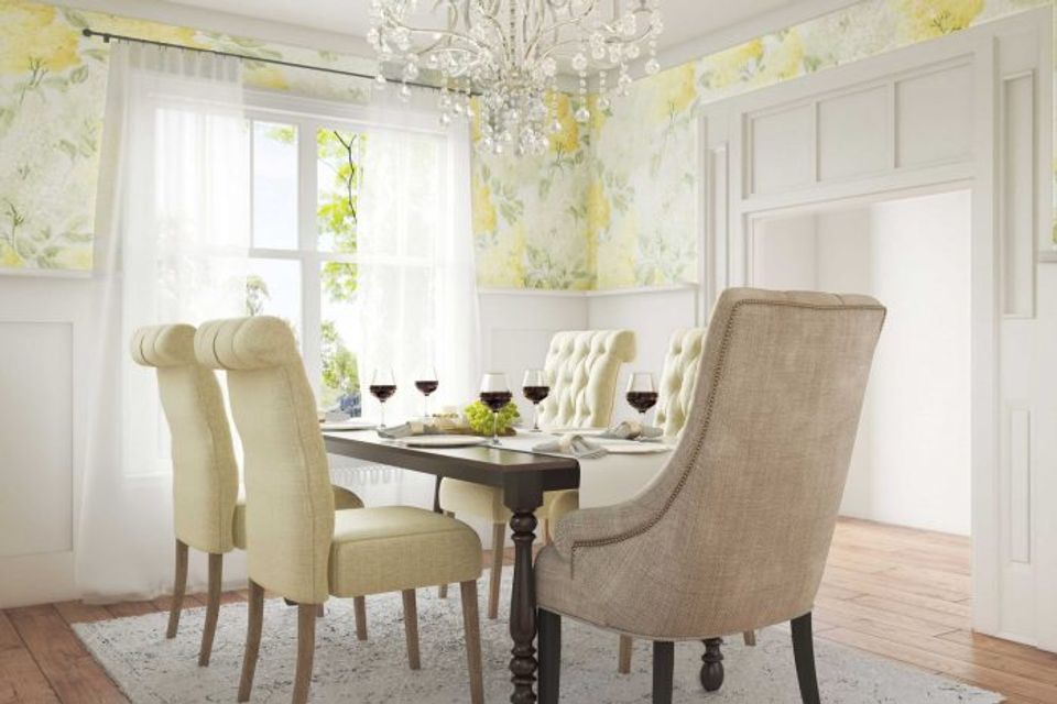 Elegant dining room with pale yellow floral wallpaper, cream furnishings, and refined romantic atmosphere