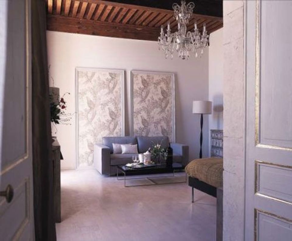 Sophisticated living room with lavender damask peel-and-stick wallpaper creating romantic ambiance