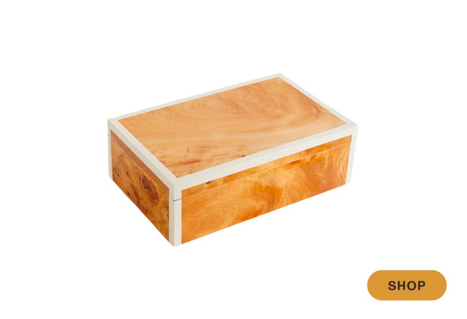 Amber wood box with white metal banding and figured grain pattern