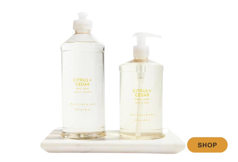 Citrus-scented liquid soap bottles in cream and white, clean minimalist aesthetic