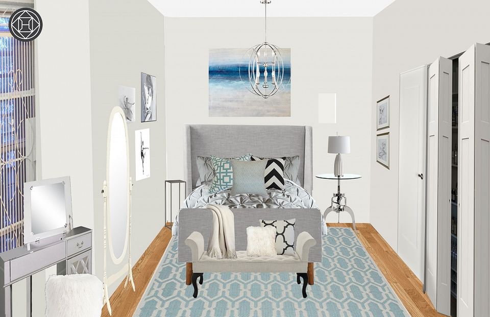 Coastal-inspired hallway with light blue geometric rug and serene ocean artwork