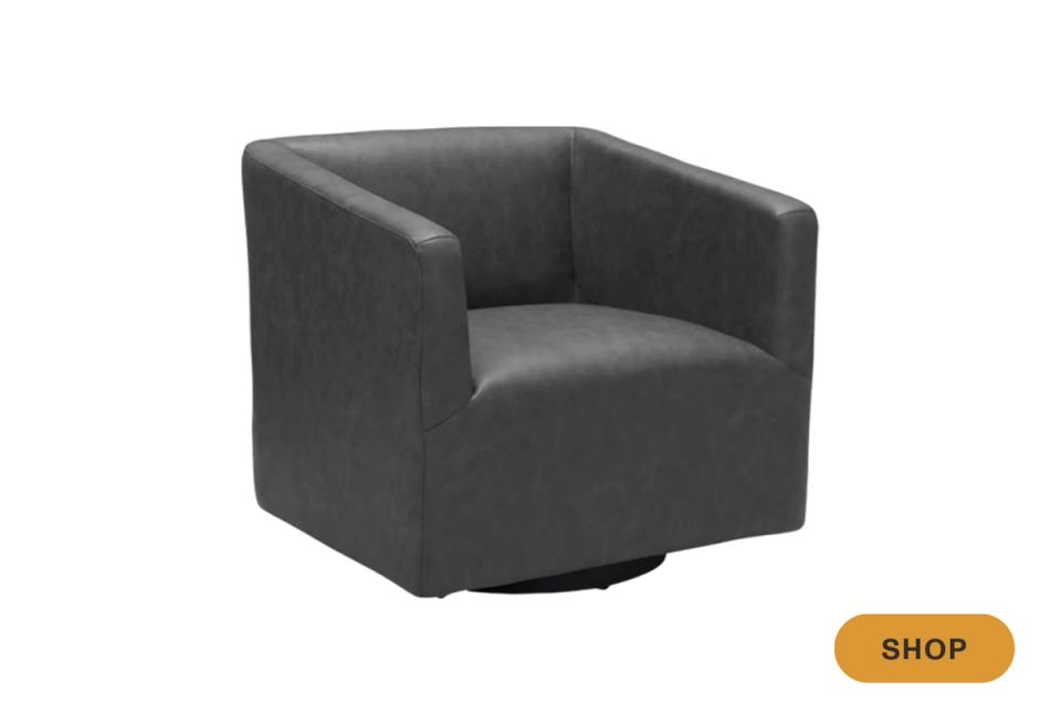 Minimalist charcoal gray swivel chair with geometric form and low profile