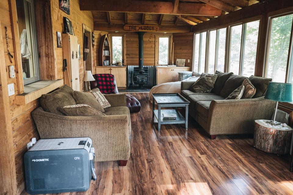 Cozy cabin living with warm wood tones, natural textiles, and inviting lodge-style atmosphere