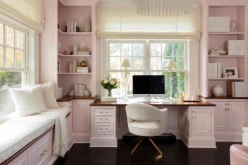 Soft feminine bedroom office with blush built-ins, white accents, natural light, and gentle pink tones in modern cottage style