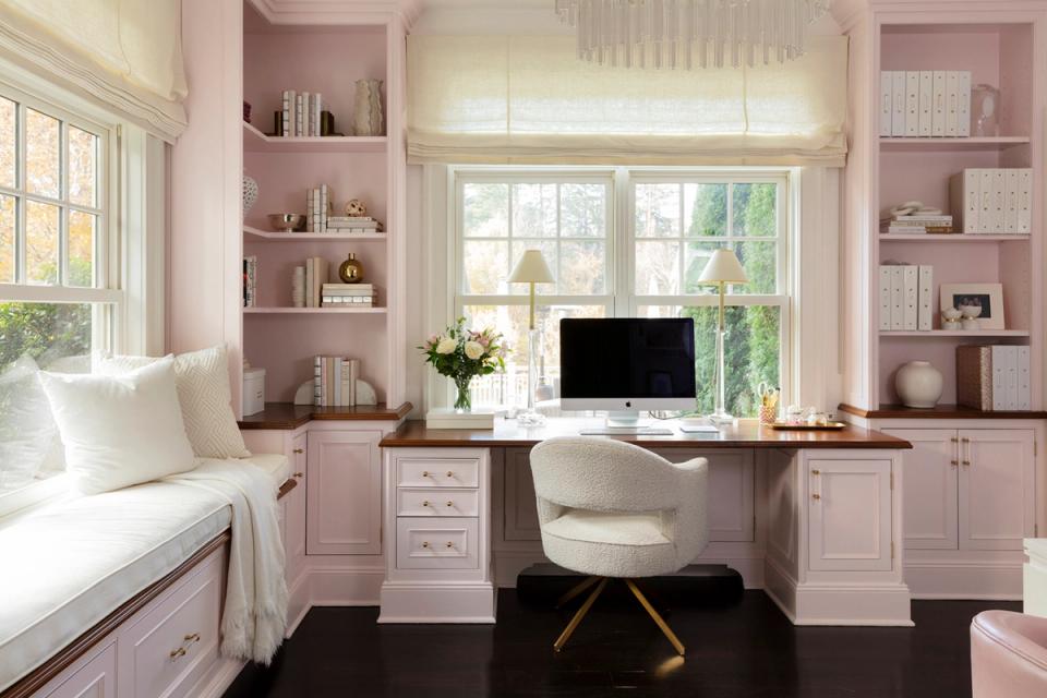 Soft feminine bedroom office with blush built-ins, white accents, natural light, and gentle pink tones in modern cottage style