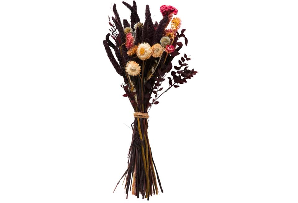 Dark moody dried flower arrangement blending burgundy, cream, and black elements
