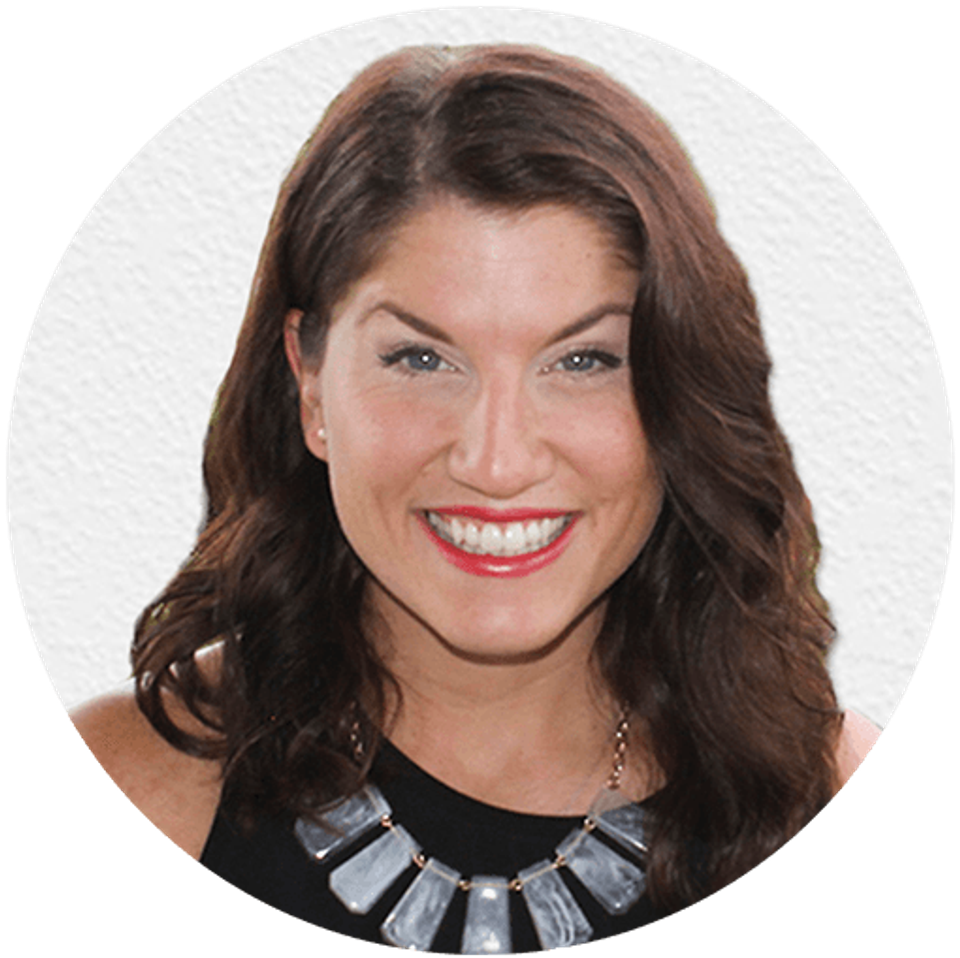 Designer Jordan E., smiling portrait headshot with statement necklace