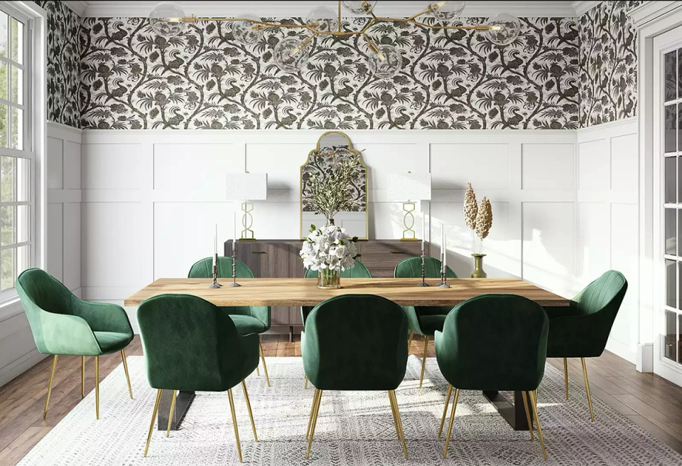 Art Deco dining room with emerald velvet chairs, geometric patterned wallpaper, and brass accents in luxe jewel tones