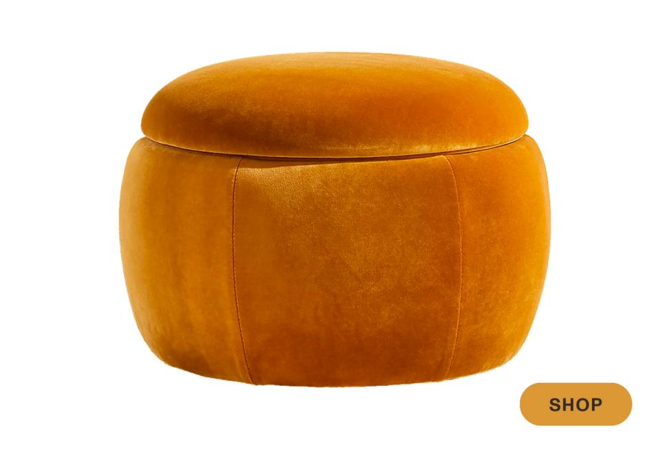 Bold mustard yellow velvet round ottoman with modern sculptural form