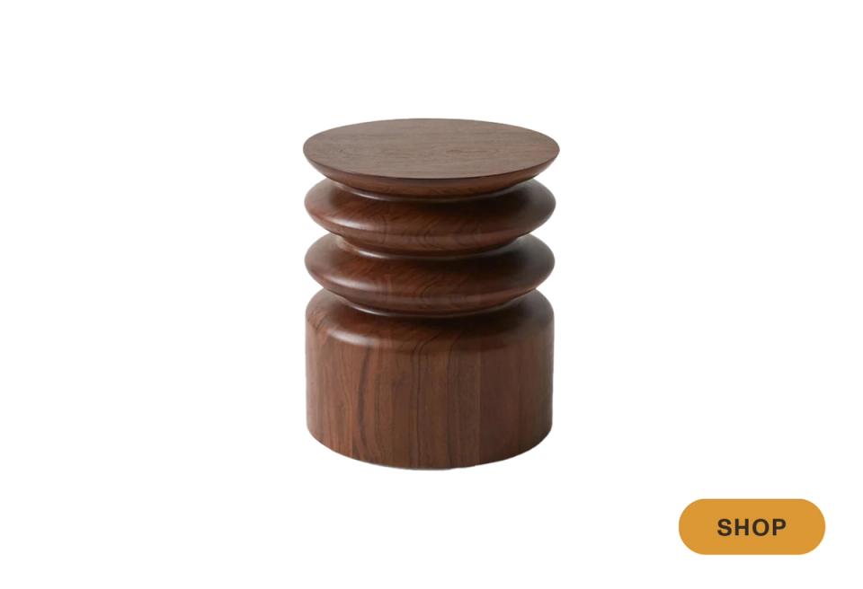 Mid-century walnut stacked drum table with sculptural base, warm organic aesthetic