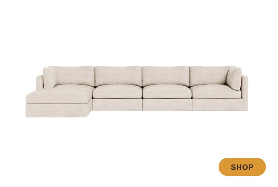 Modern modular sectional sofa in soft cream upholstery with clean lines