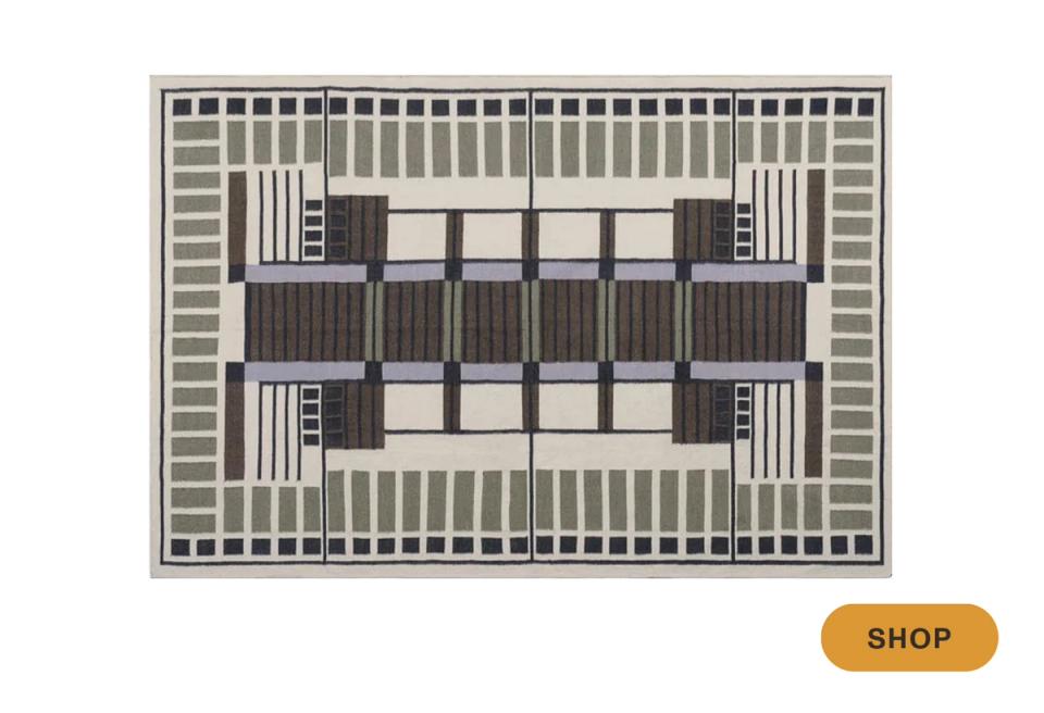 Modern geometric area rug in charcoal and cream with bold linear Art Deco-inspired motifs