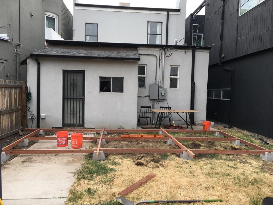 Industrial modern backyard transformation from bare ground to clean contemporary design ready for development