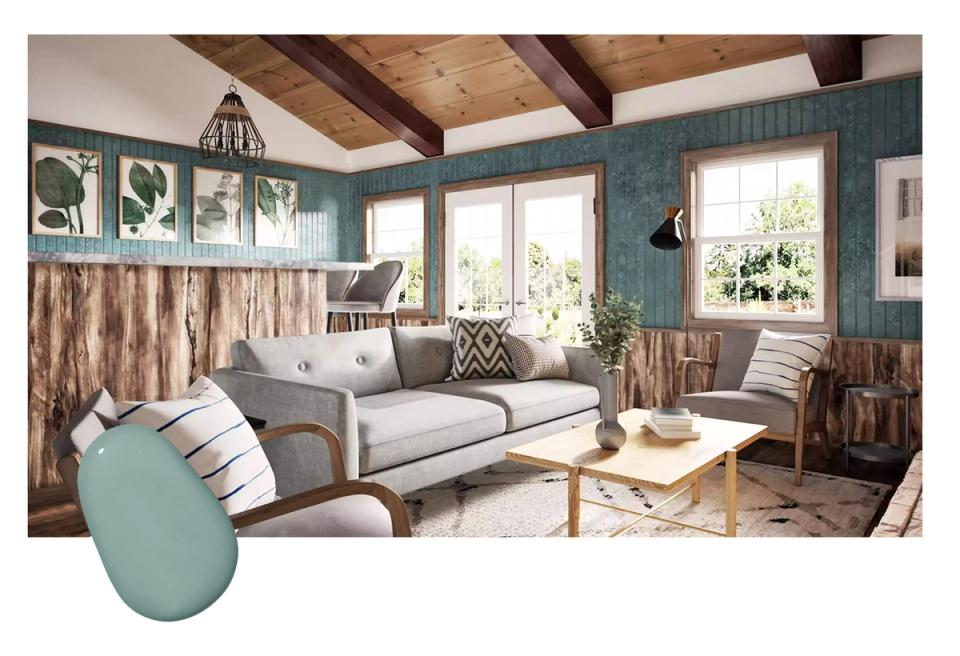 Rustic coastal living room blending muted teal walls, exposed wood beams, light upholstery, and natural textures for relaxed warmth