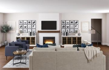 Bright farmhouse living room with neutral tones, fireplace focal point, symmetrical gallery walls, and cozy textured furnishings