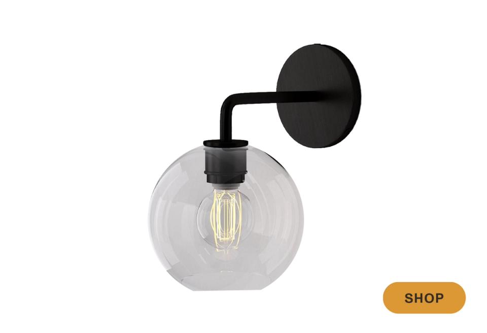 Industrial chic clear glass globe pendant with black metal hardware