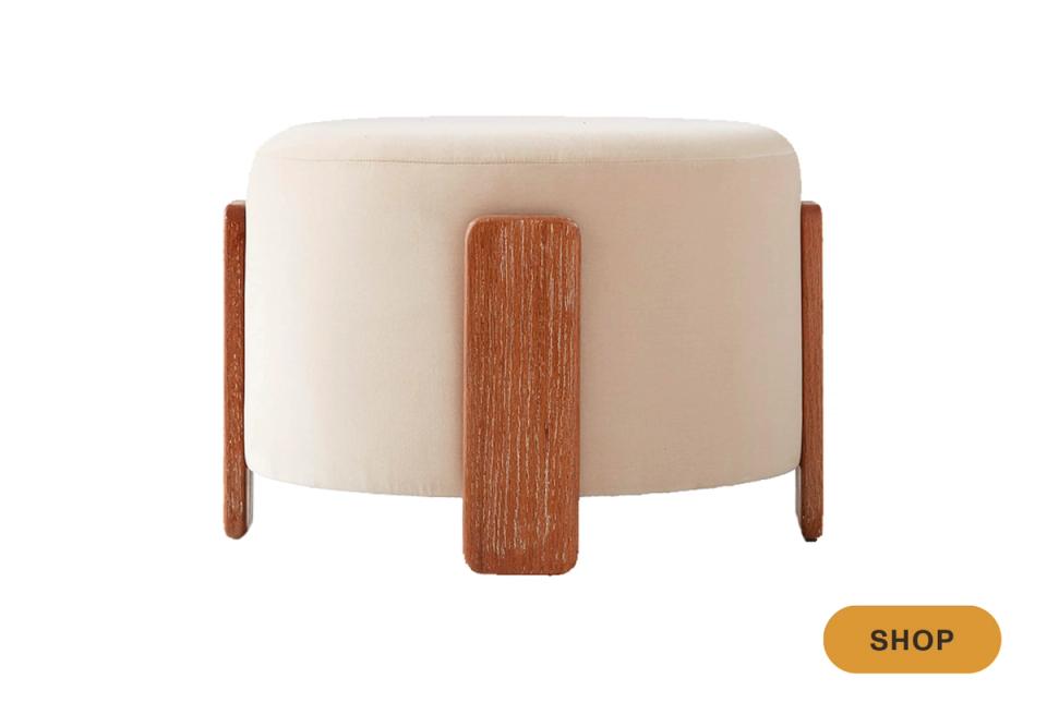 Mid-century modern round ottoman in cream with warm walnut wood handles