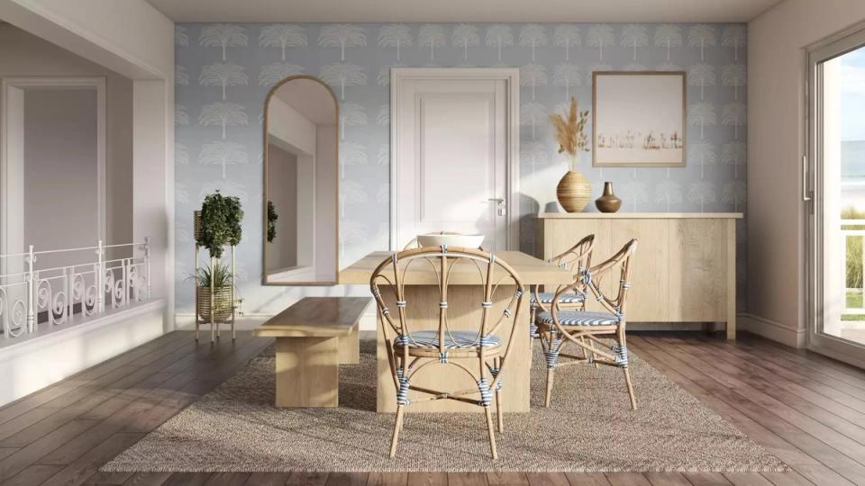 Soft coastal dining area with blue-gray shiplap walls, natural wood accents, and woven pendant light