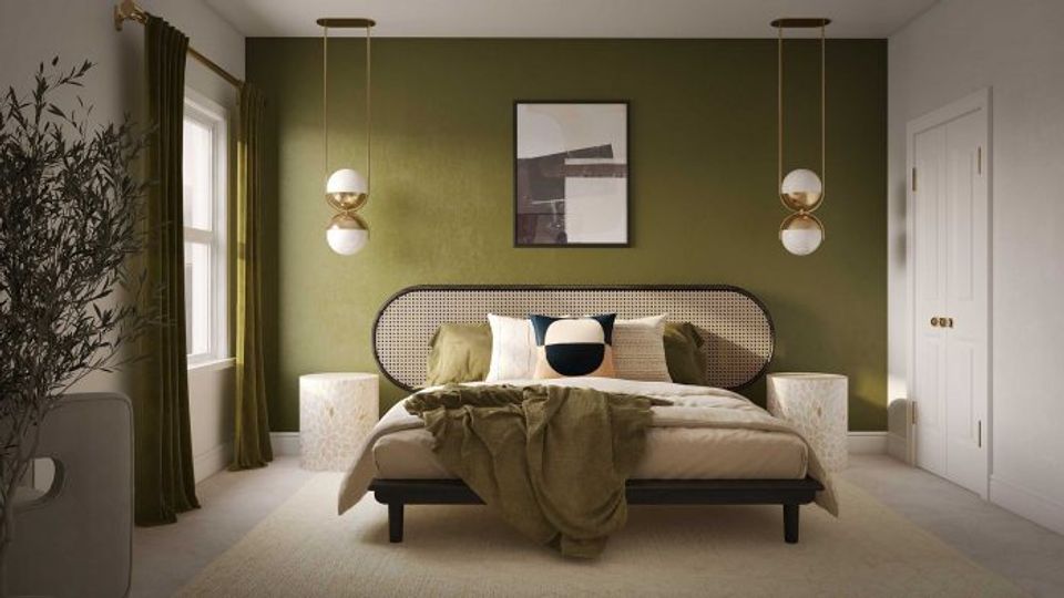 Earthy modern bedroom with olive-green walls, round rattan headboard, and sculptural pendant lights