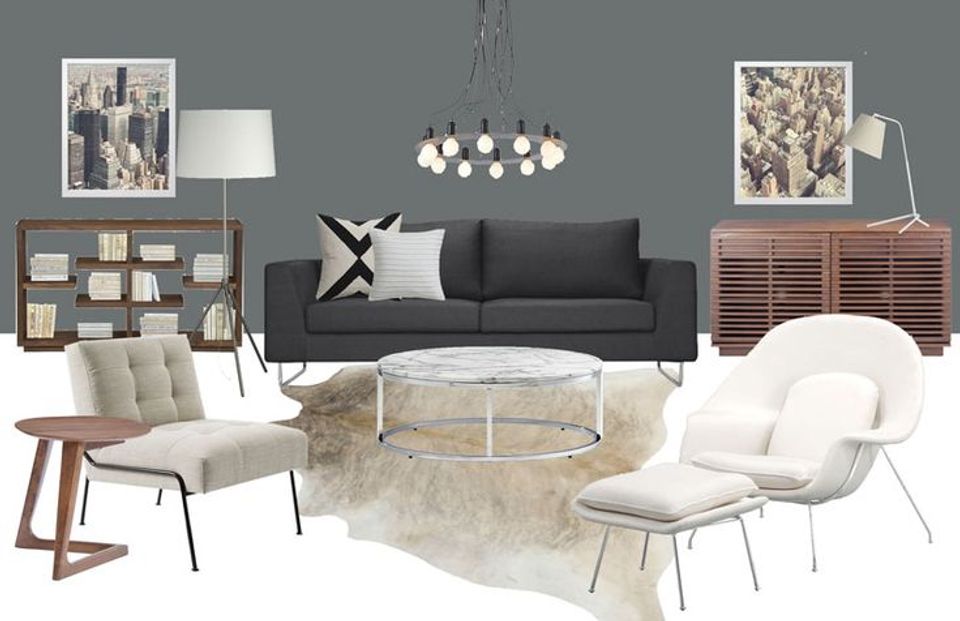 Serene living room with slate gray walls, charcoal sofa, white lounge chairs, wood storage, and monochromatic palette