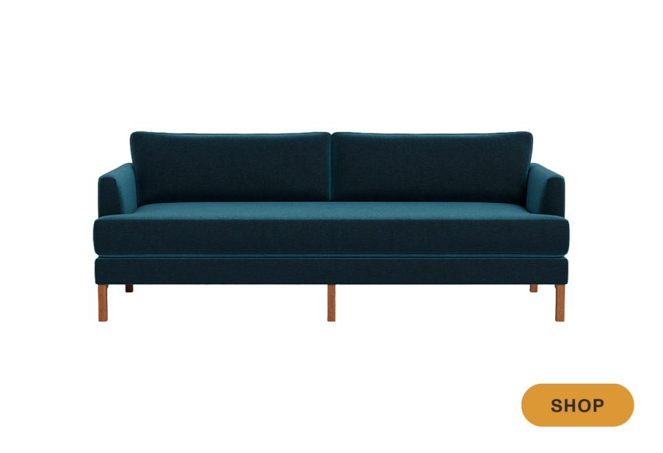 Jewel-tone teal mid-century sofa with wooden leg frame and tapered supports